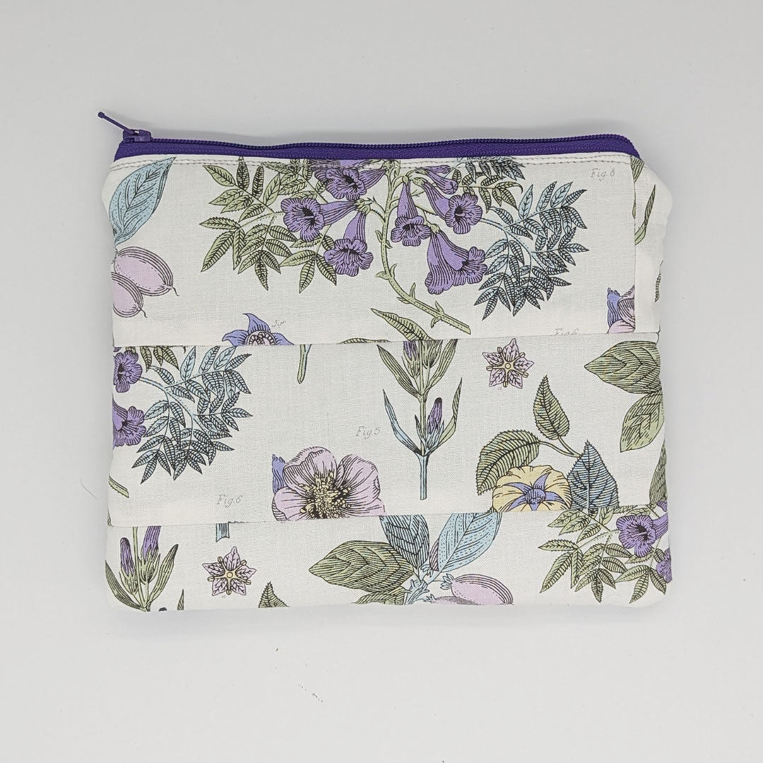 Floral patterned pouch with a zipper on a white background