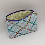 Floral lattice makeup bag with a purple zipper