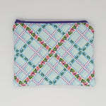 Floral lattice makeup bag with a purple zipper