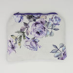Floral pouch with purple roses on a light background